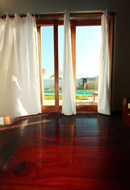 The master bedroom of each Kites Mancora house looks out on the pool